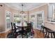Sun-lit breakfast nook features a round table and access to a private outdoor area at 2560 Millwater Xing, Dacula, GA 30019