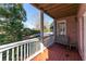 Relaxing covered deck with a view of the pool, featuring comfortable seating and a peaceful atmosphere at 2560 Millwater Xing, Dacula, GA 30019
