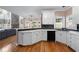 Modern kitchen features white cabinetry, stone backsplash, and stainless steel appliances at 2560 Millwater Xing, Dacula, GA 30019