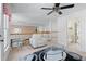 A spacious and well-lit upper landing with seating area and neutral carpet at 2560 Millwater Xing, Dacula, GA 30019