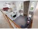 A large living room includes built-in shelving and a floor-to-ceiling stone fireplace at 2560 Millwater Xing, Dacula, GA 30019