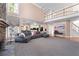 A large living room includes built-in shelving and a floor-to-ceiling stone fireplace at 2560 Millwater Xing, Dacula, GA 30019