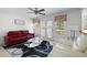 Cozy living room with bright windows, ceiling fan, stylish rug, and comfortable seating at 2560 Millwater Xing, Dacula, GA 30019