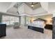 Spacious bedroom with tray ceilings, a sitting area, and large windows, offering a peaceful retreat at 2560 Millwater Xing, Dacula, GA 30019