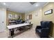 Functional home office featuring built-in bookshelves, a large desk and a comfortable chair at 2560 Millwater Xing, Dacula, GA 30019