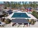 Community pool area includes covered picnic shelters and ample seating, perfect for relaxation and gatherings at 2560 Millwater Xing, Dacula, GA 30019