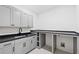 Functional laundry room with ample counter space and modern cabinetry at 2657 Ashford Ne Rd, Brookhaven, GA 30319