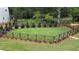 Beautifully fenced backyard surrounded by mature trees and manicured landscaping at 3927 Enclave Way, Tucker, GA 30084
