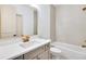 Bathroom featuring tile surround, and a modern vanity with gold fixtures at 3927 Enclave Way, Tucker, GA 30084