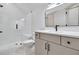 Modern bathroom with white tiling, sleek fixtures, and a glass-enclosed shower at 3927 Enclave Way, Tucker, GA 30084