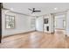 Spacious bedroom featuring hardwood floors, a ceiling fan, and ample natural light at 3927 Enclave Way, Tucker, GA 30084