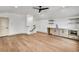 Bonus room with a small bar area, light hardwood floors, and natural light at 3927 Enclave Way, Tucker, GA 30084