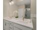 Bright bathroom with a double sink vanity, large mirror, and view of a glass-enclosed shower at 4524 Mikajack Se Dr, Smyrna, GA 30080