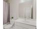 Bathroom featuring a tub with shower and a white vanity with a sink and a modern faucet at 4524 Mikajack Se Dr, Smyrna, GA 30080