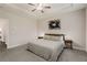 Bedroom with tray ceiling, ceiling fan, and modern decor at 4524 Mikajack Se Dr, Smyrna, GA 30080