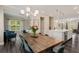Open-concept dining room with modern chandelier and hardwood floors at 4524 Mikajack Se Dr, Smyrna, GA 30080