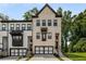 Charming townhome with a modern two-car garage and brick facade at 4524 Mikajack Se Dr, Smyrna, GA 30080