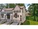 View of the stylish townhome with a two-car garage and brick facade at 4524 Mikajack Se Dr, Smyrna, GA 30080