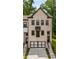 Charming townhome with a modern two-car garage and brick facade at 4524 Mikajack Se Dr, Smyrna, GA 30080