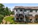 View of the back of the townhome featuring a private deck perfect for entertaining at 4524 Mikajack Se Dr, Smyrna, GA 30080