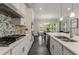Bright eat-in kitchen with stainless steel appliances and a large island at 4524 Mikajack Se Dr, Smyrna, GA 30080