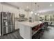 Bright eat-in kitchen with stainless steel appliances and a large island at 4524 Mikajack Se Dr, Smyrna, GA 30080