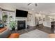 Open-concept living area with hardwood floors, fireplace, and built-in shelves at 4524 Mikajack Se Dr, Smyrna, GA 30080