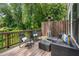 Outdoor patio area with seating, wooded views, and a heater at 4524 Mikajack Se Dr, Smyrna, GA 30080
