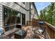 Cozy patio with wicker furniture and wooded view at 4524 Mikajack Se Dr, Smyrna, GA 30080