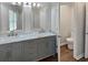 Bathroom featuring double vanity with marble countertop and modern fixtures at 6390 E Stubbs Rd, Atlanta, GA 30349
