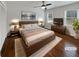 Modern bedroom with hardwood floors, natural light, and neutral decor at 6390 E Stubbs Rd, Atlanta, GA 30349