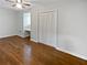 A warm bedroom with a ceiling fan and closet at 6390 E Stubbs Rd, Atlanta, GA 30349