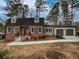 Charming brick home with a well-manicured lawn and an attached two-car garage at 6390 E Stubbs Rd, Atlanta, GA 30349