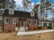 Charming brick home with a well-manicured lawn and an attached two-car garage at 6390 E Stubbs Rd, Atlanta, GA 30349