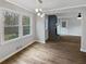 An open living room with a view from large windows and a fireplace at 6390 E Stubbs Rd, Atlanta, GA 30349