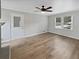 A cozy living room featuring a ceiling fan and great natural light at 6390 E Stubbs Rd, Atlanta, GA 30349