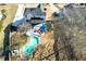 Aerial view showcasing backyard with a pool, patio with red chairs, and mature trees at 2167 Tully Wren Ne, Marietta, GA 30066