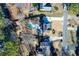 Aerial of the backyard showing the pool, patio set, playset, trampoline, and manicured yard at 2167 Tully Wren Ne, Marietta, GA 30066