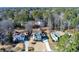 Wide aerial view of neighborhood and home with mature trees, manicured lawns, and winding streets at 2167 Tully Wren Ne, Marietta, GA 30066