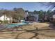 Wide backyard featuring a pool, covered deck, and an outdoor grilling area at 2167 Tully Wren Ne, Marietta, GA 30066