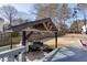 View of outdoor kitchen with grill and backyard on multi-level lot at 2167 Tully Wren Ne, Marietta, GA 30066