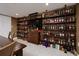 Finished basement boasting a custom liquor cabinet with fully stocked shelves and a table for entertaining at 2167 Tully Wren Ne, Marietta, GA 30066