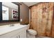 Fun bathroom with treasure map shower curtain, white vanity, dark wood mirror, and skull decor at 2167 Tully Wren Ne, Marietta, GA 30066