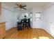 Sunlit dining area with hardwood floors, a modern table set, and large windows offering a pleasant view at 2167 Tully Wren Ne, Marietta, GA 30066