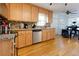 An inviting kitchen features stainless steel appliances, granite counters, hardwood floors, and a cozy dining nook at 2167 Tully Wren Ne, Marietta, GA 30066