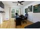 Well-lit home office with a modern desk setup, comfortable gaming chair, and stylish decor against a hardwood floor at 2167 Tully Wren Ne, Marietta, GA 30066