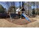 Playground set in a large backyard with swing set and slide at 2167 Tully Wren Ne, Marietta, GA 30066