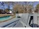 Outdoor pool with a built in bench on a grey painted deck at 2167 Tully Wren Ne, Marietta, GA 30066