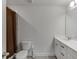 Modern bathroom with white cabinets, sleek fixtures, and a shower with brown curtain at 3410 Summerpoint Xing, Cumming, GA 30028