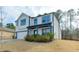 Beautiful two-story home with white siding, a covered porch, and a two-car garage at 3410 Summerpoint Xing, Cumming, GA 30028